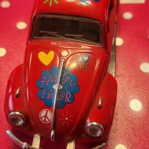 Red Toy Car with Flower Design